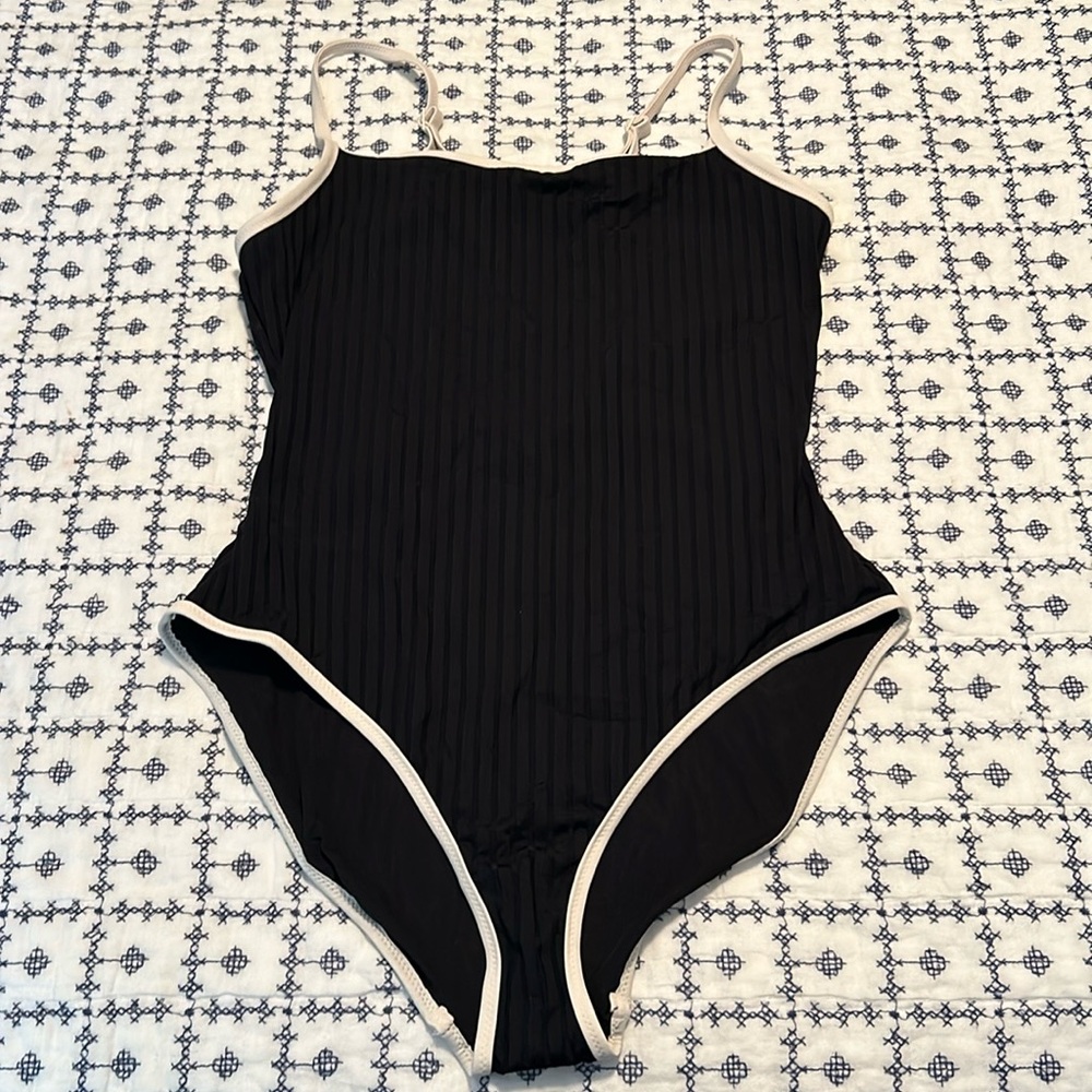 Ribbed black swimsuit with white trim